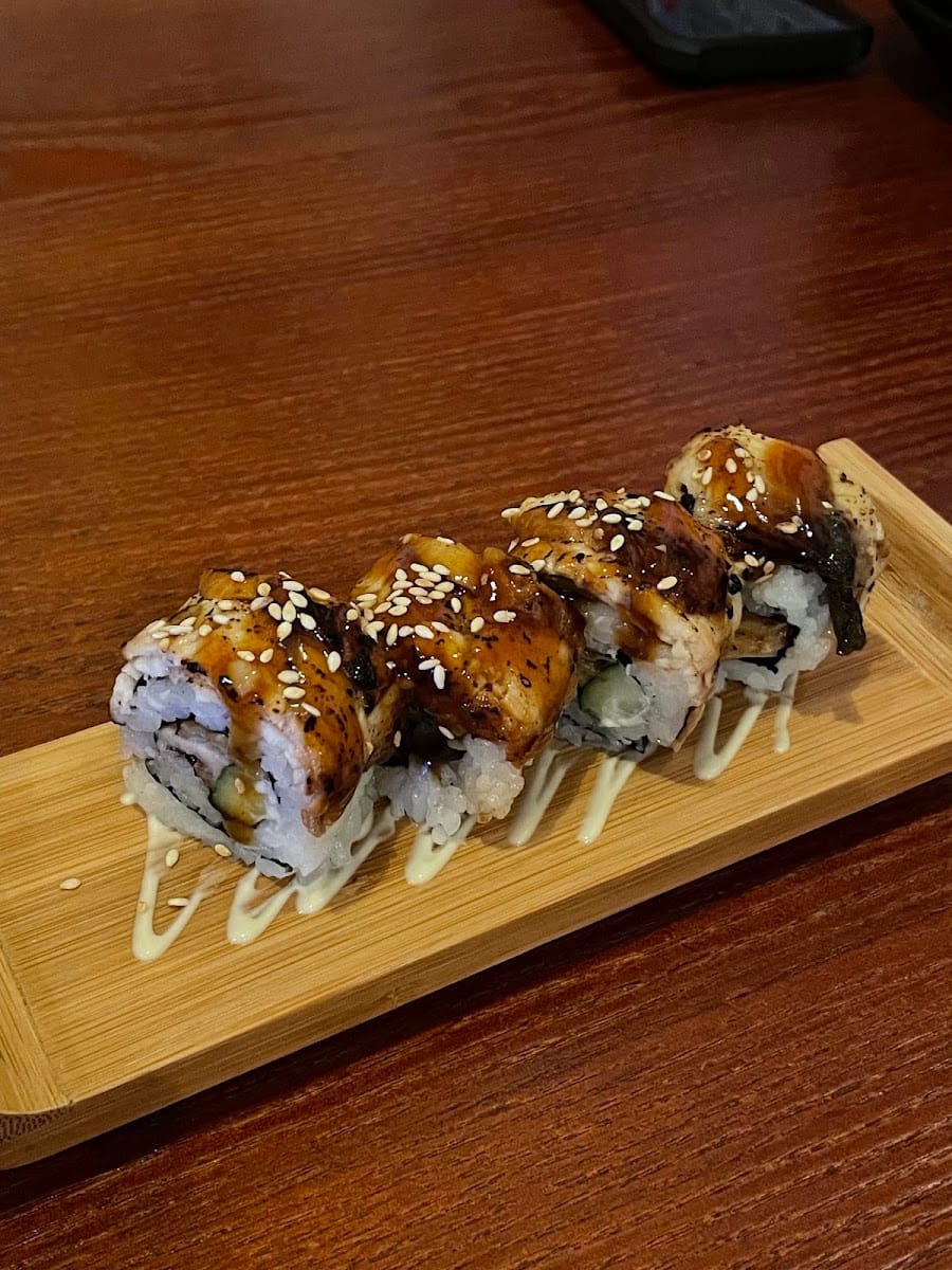 Grilled eel hand rolls on a bamboo tray at Kulai